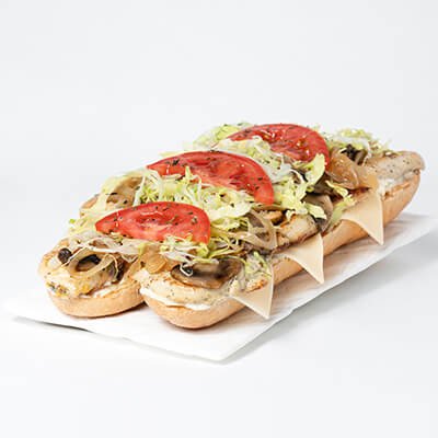 Submarine sandwich with cheese, chicken, lettuce, tomatoes, on a white background