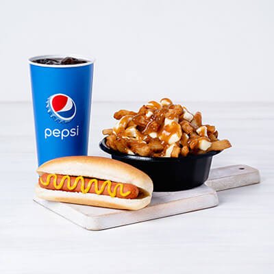 Trio of a steamed hot dog with mustard, poutine and Pepsi drink on a board on a white background